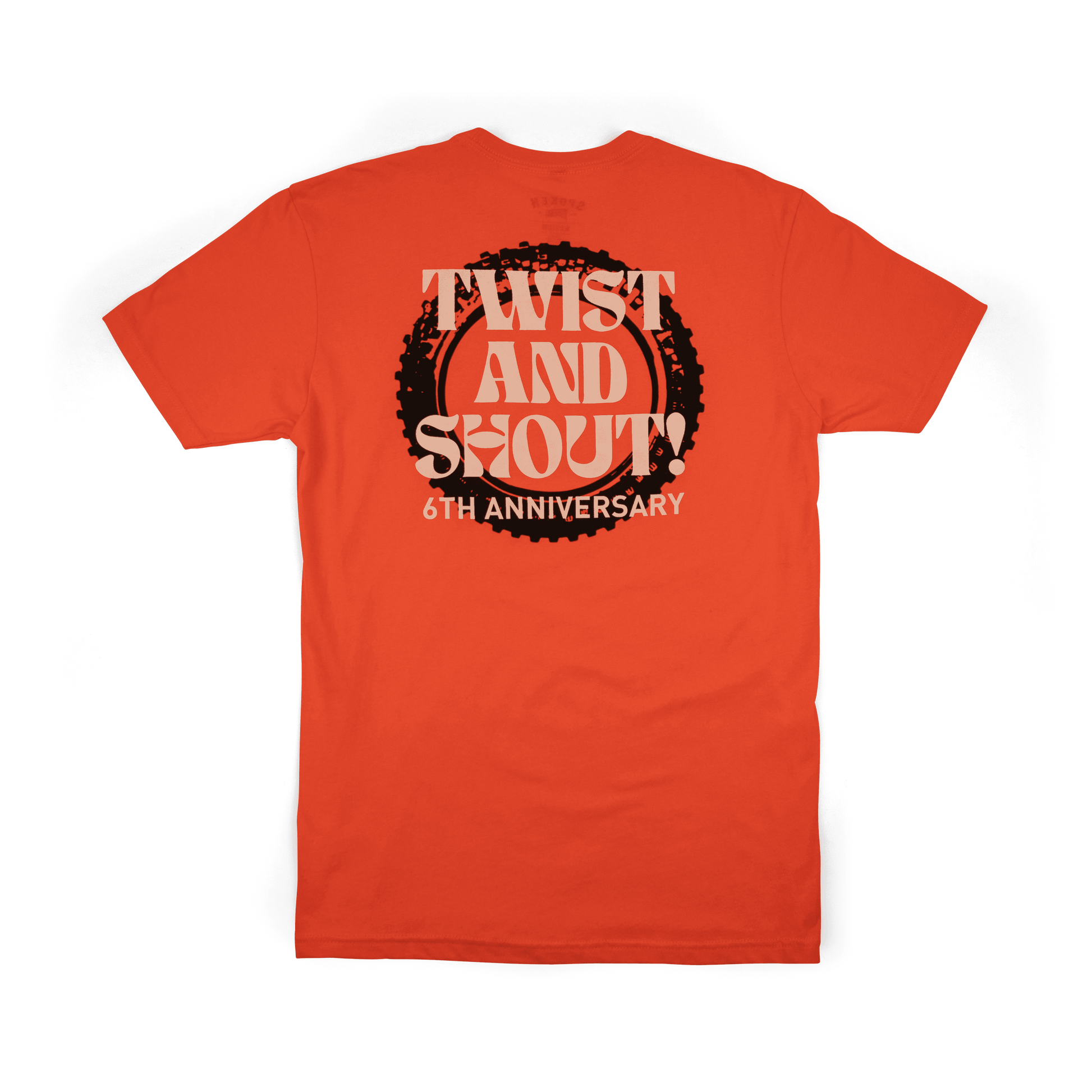 The back of the tee: orange tee with Twist and Shout 6th anniversary lettering overlayed on a black tire image.